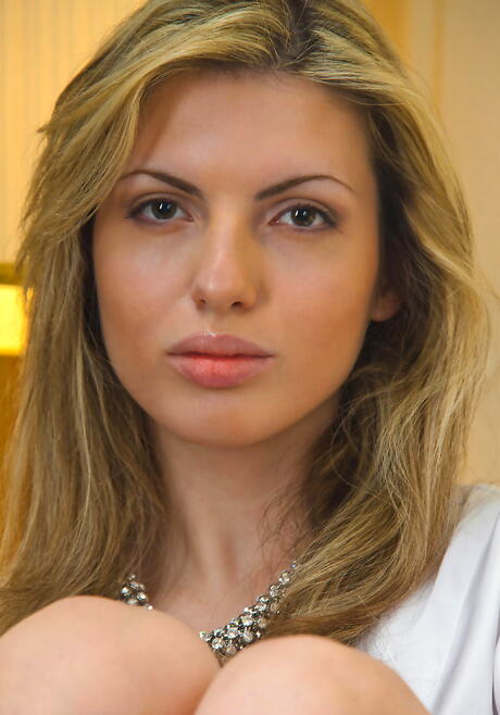 Foxy blonde youthful Maggie A showing big tits and spreading her legs 